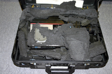Most common materials contain chemical that break down over time.  The chemicals in this common gray foam have caused it to come apart and adhere to the surface of the video camera it was supposed to protect.